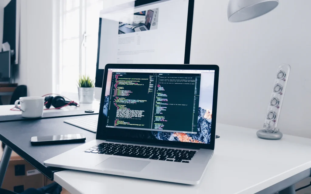 Web developer comparing the best WordPress hosting options on a laptop