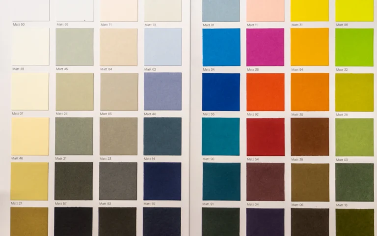 Paint swatches laid out while building a brand color palette
