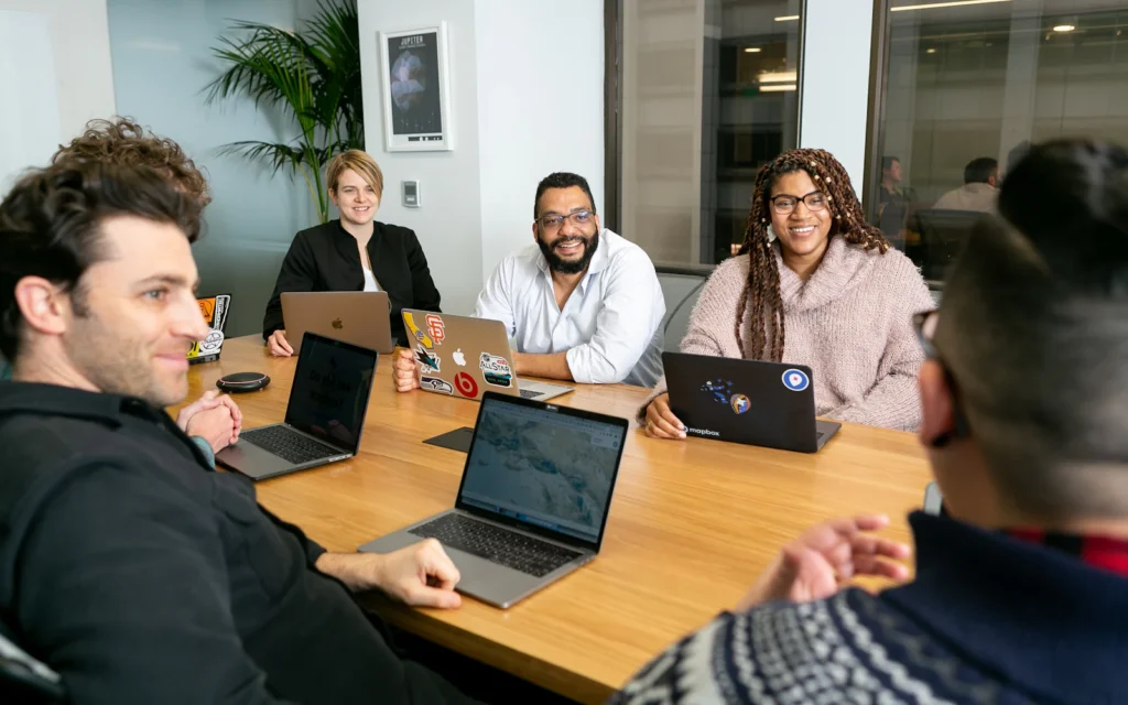 Consultant website design reviewed by a team during a client meeting