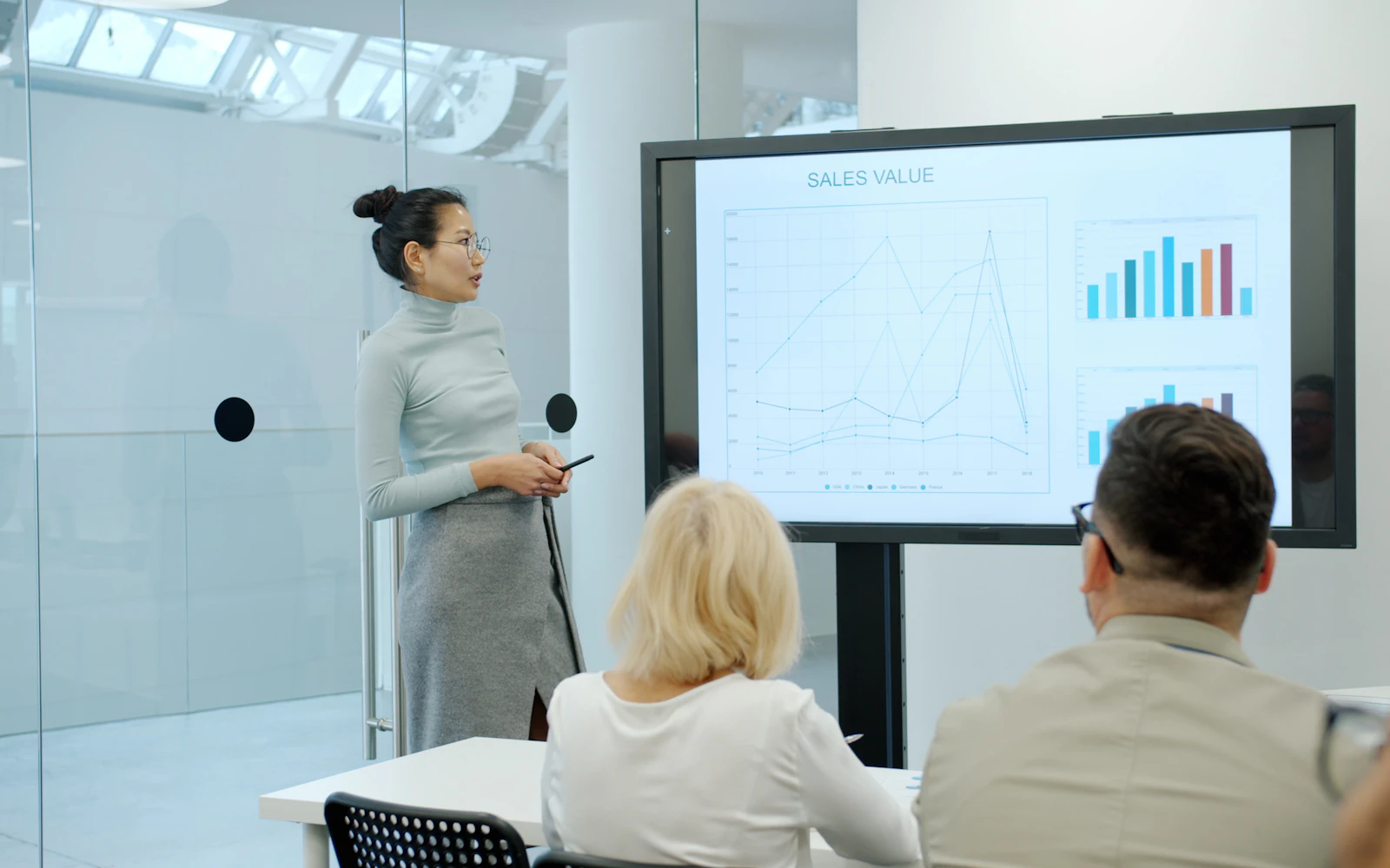 Consultant presenting to clients in a conference room