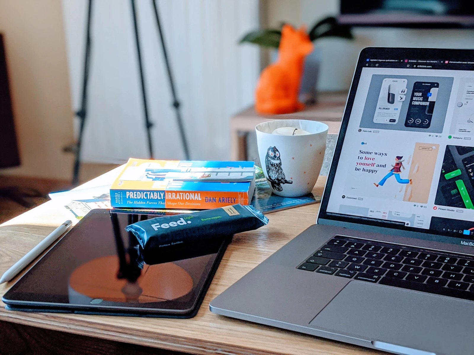 Custom website design services workspace with laptop and design tools