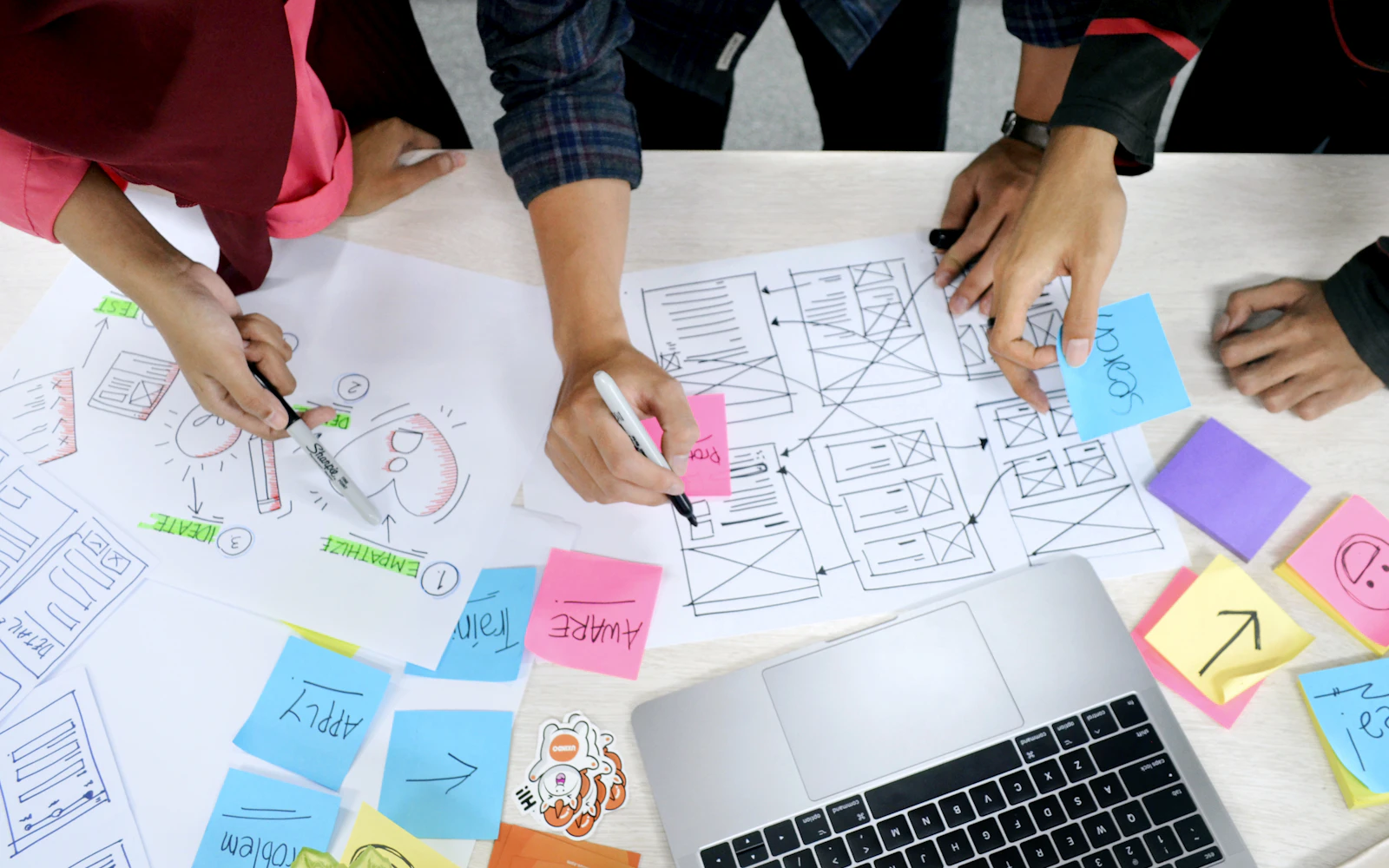 Team mapping out a website plan with sticky notes