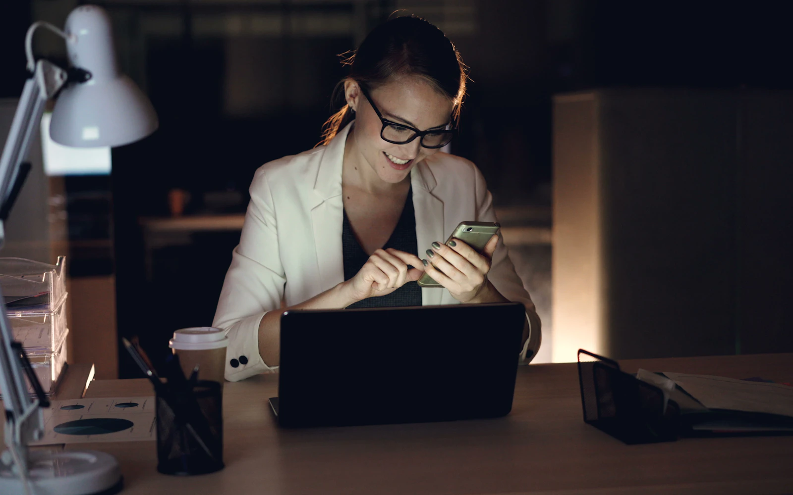 Professional reading a short newsletter at her desk