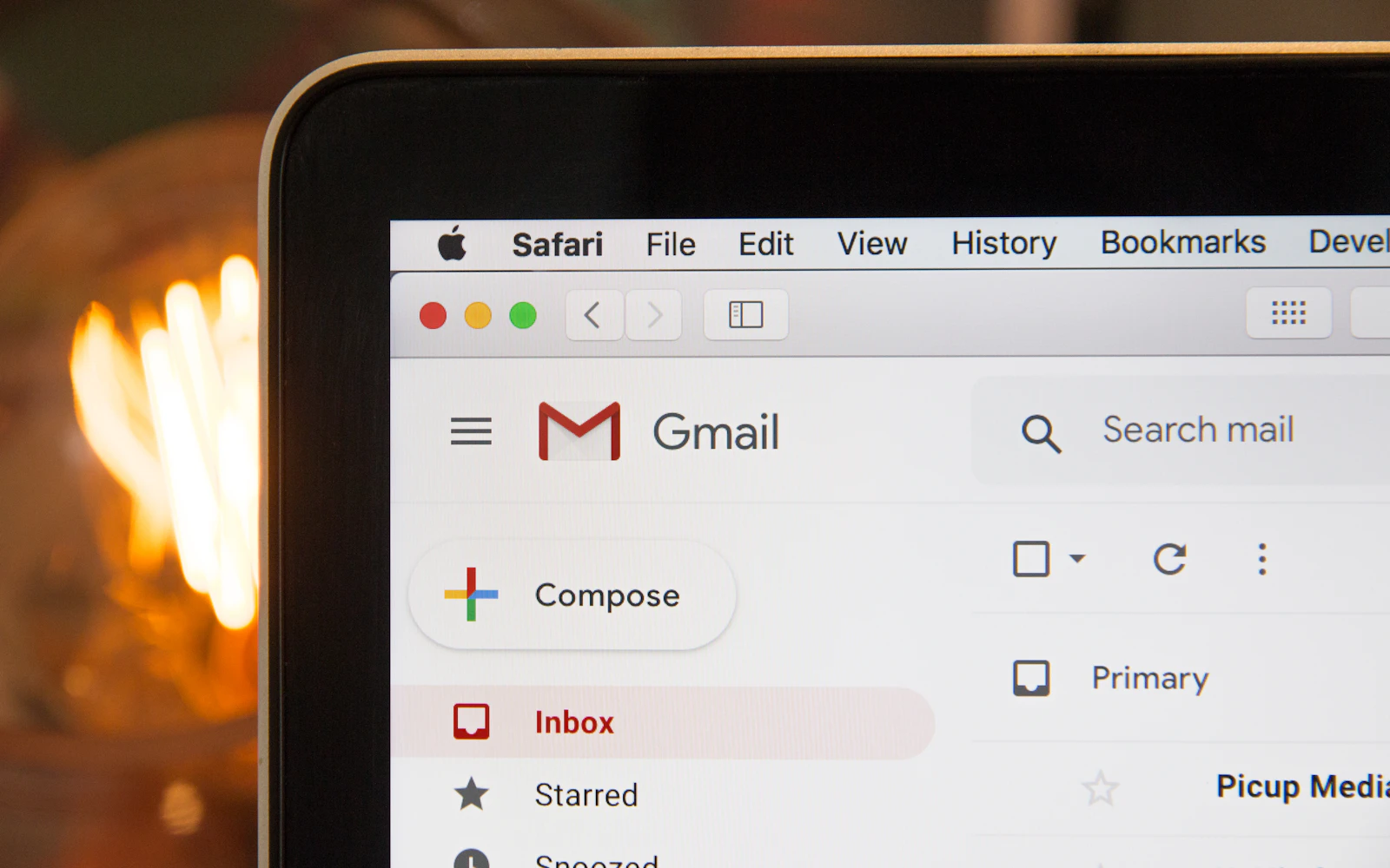 Email marketing services in progress with a newsletter being built on a laptop
