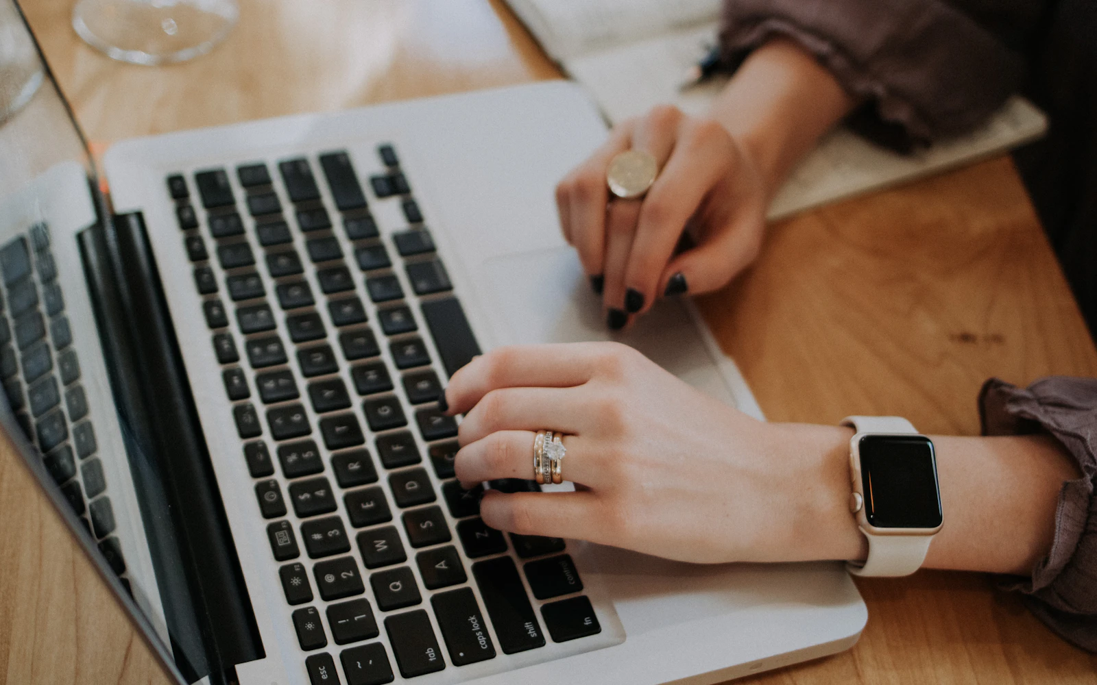 Professional drafting email newsletter ideas on a laptop