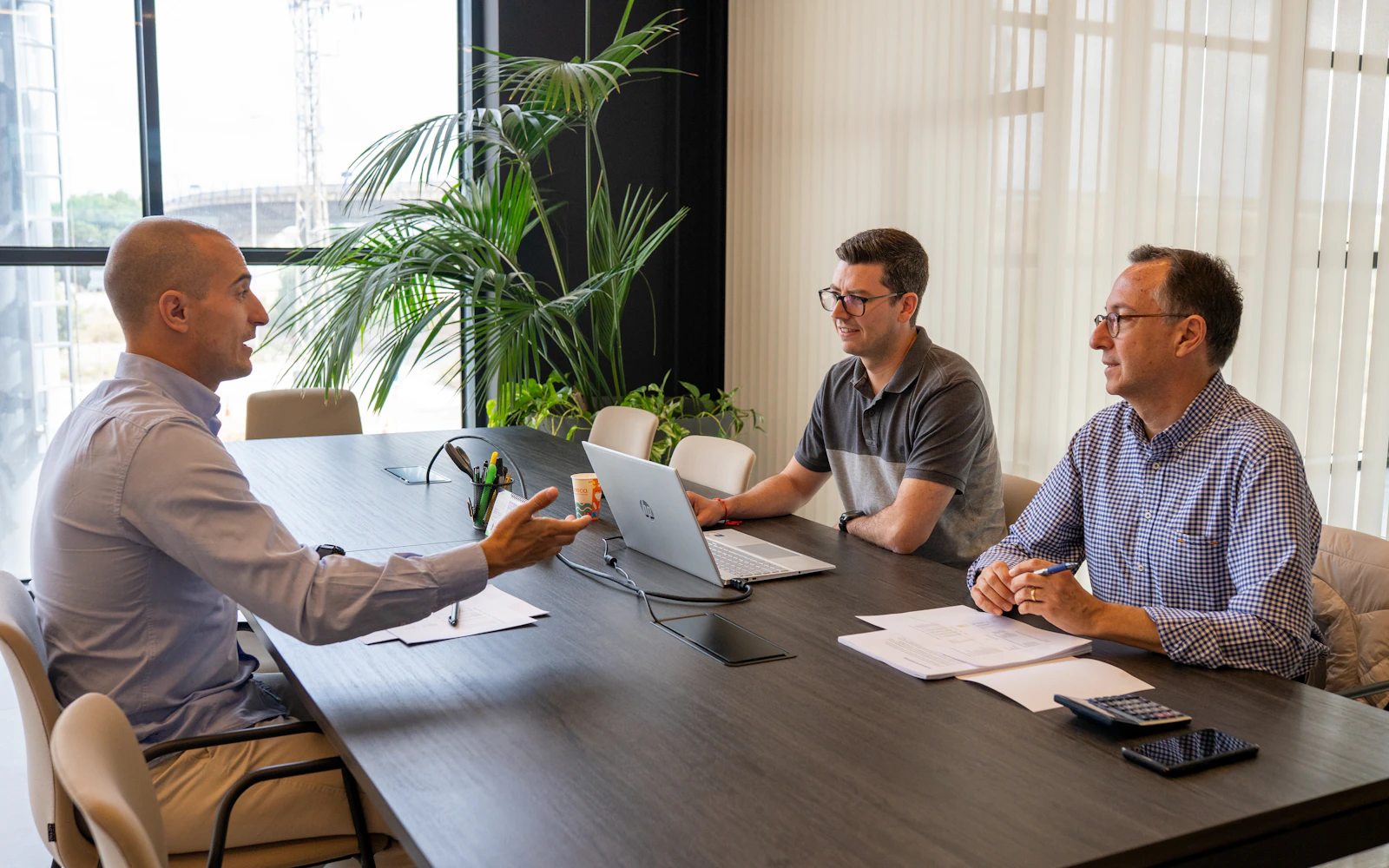 Leaders meeting around a table before a board decision