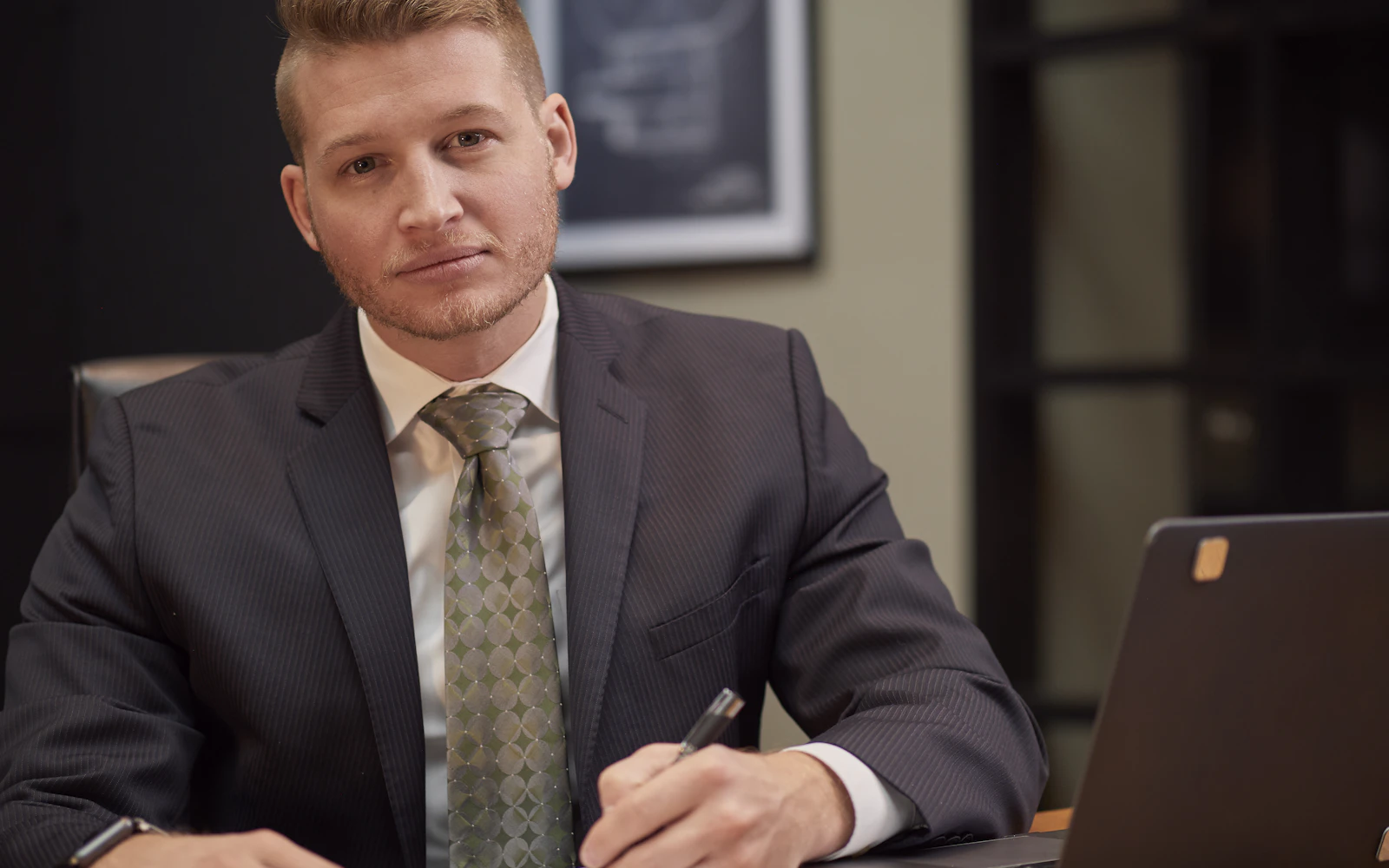 Professional expert in a suit at his office