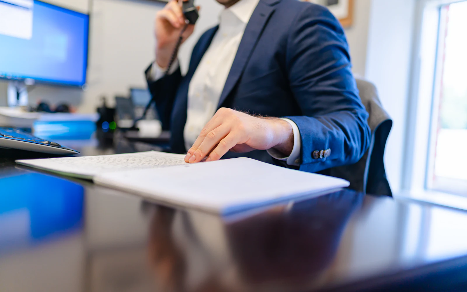 Attorney reviewing case documents before vetting an expert witness website