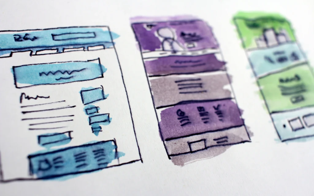 Designer sketching a wireframe using homepage design best practices
