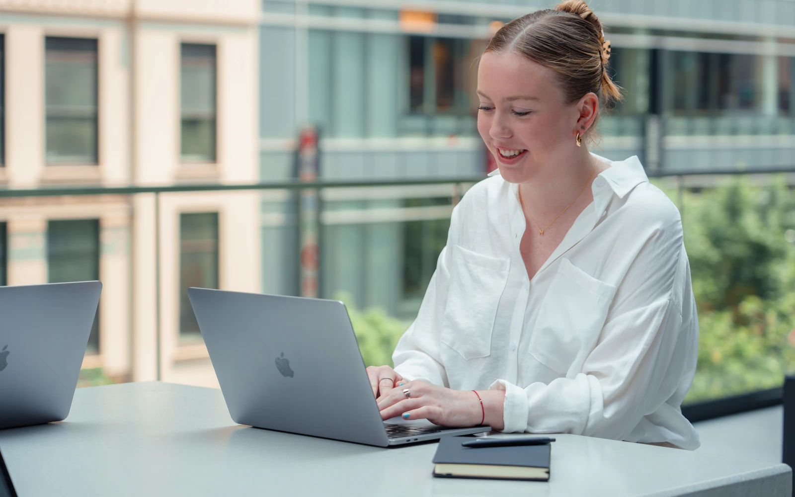 Consultant drafting a project story on a laptop for their website