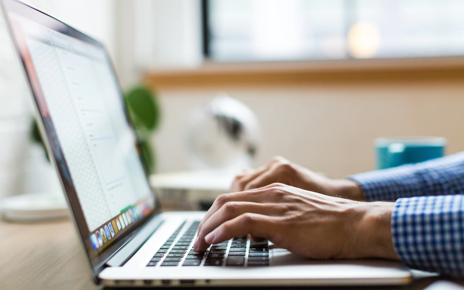 LinkedIn banner design being created on a laptop by a consultant