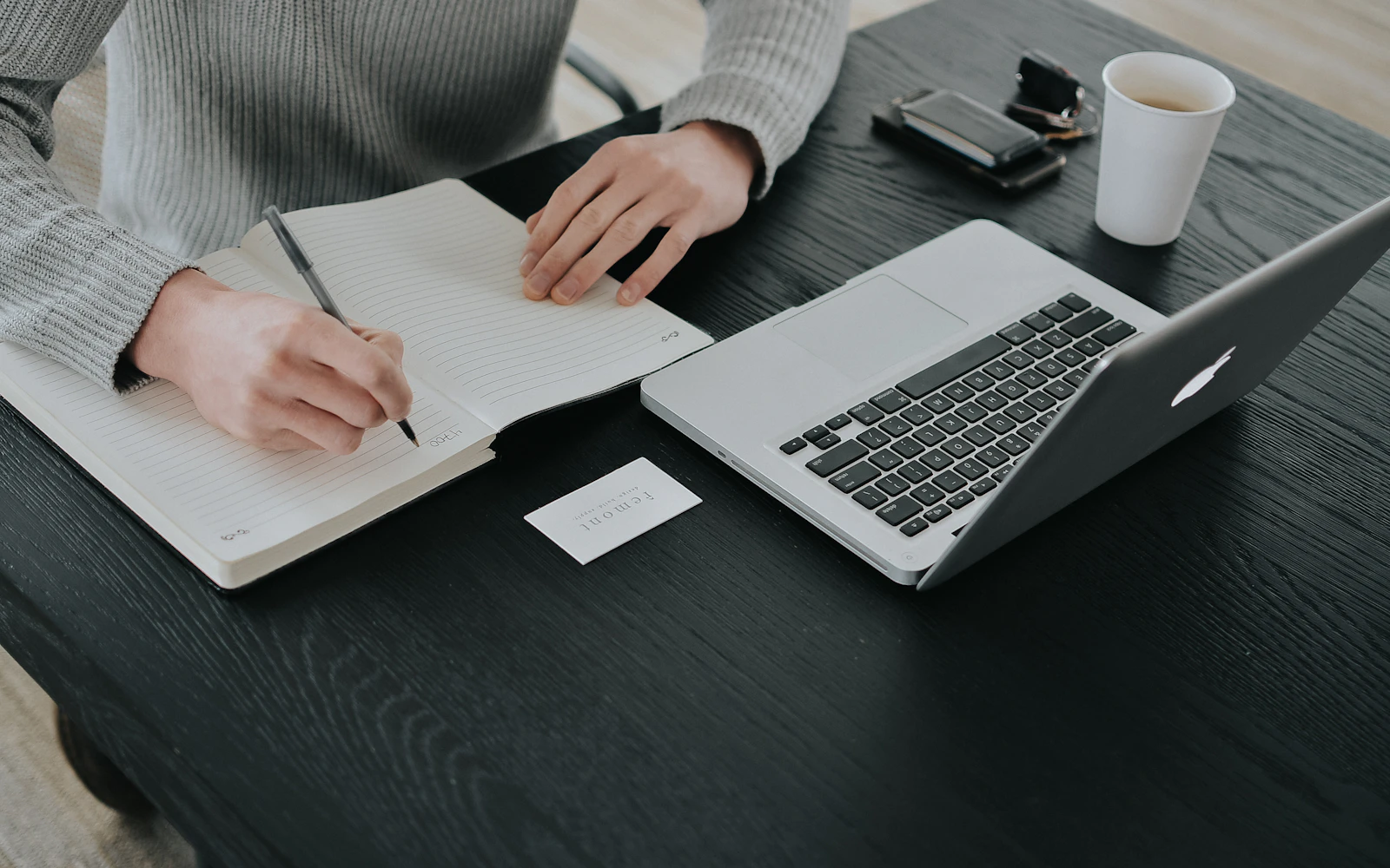 Consultant writing an issue of a LinkedIn newsletter for consultants