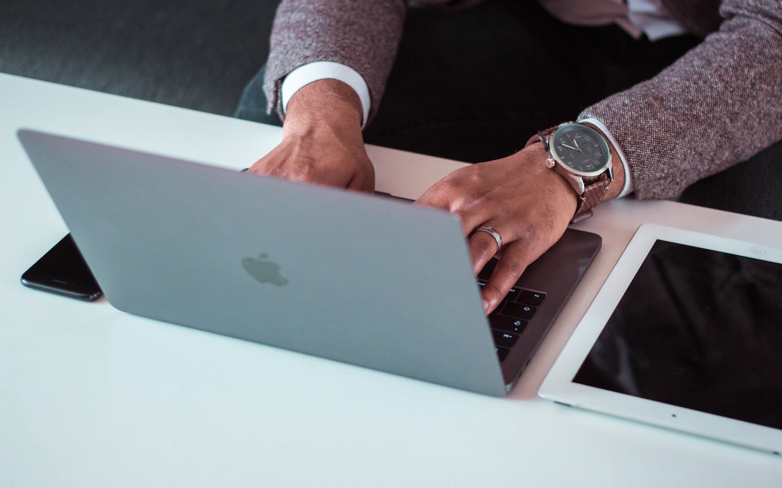 Consultant on a laptop while managed WordPress hosting keeps the site fast