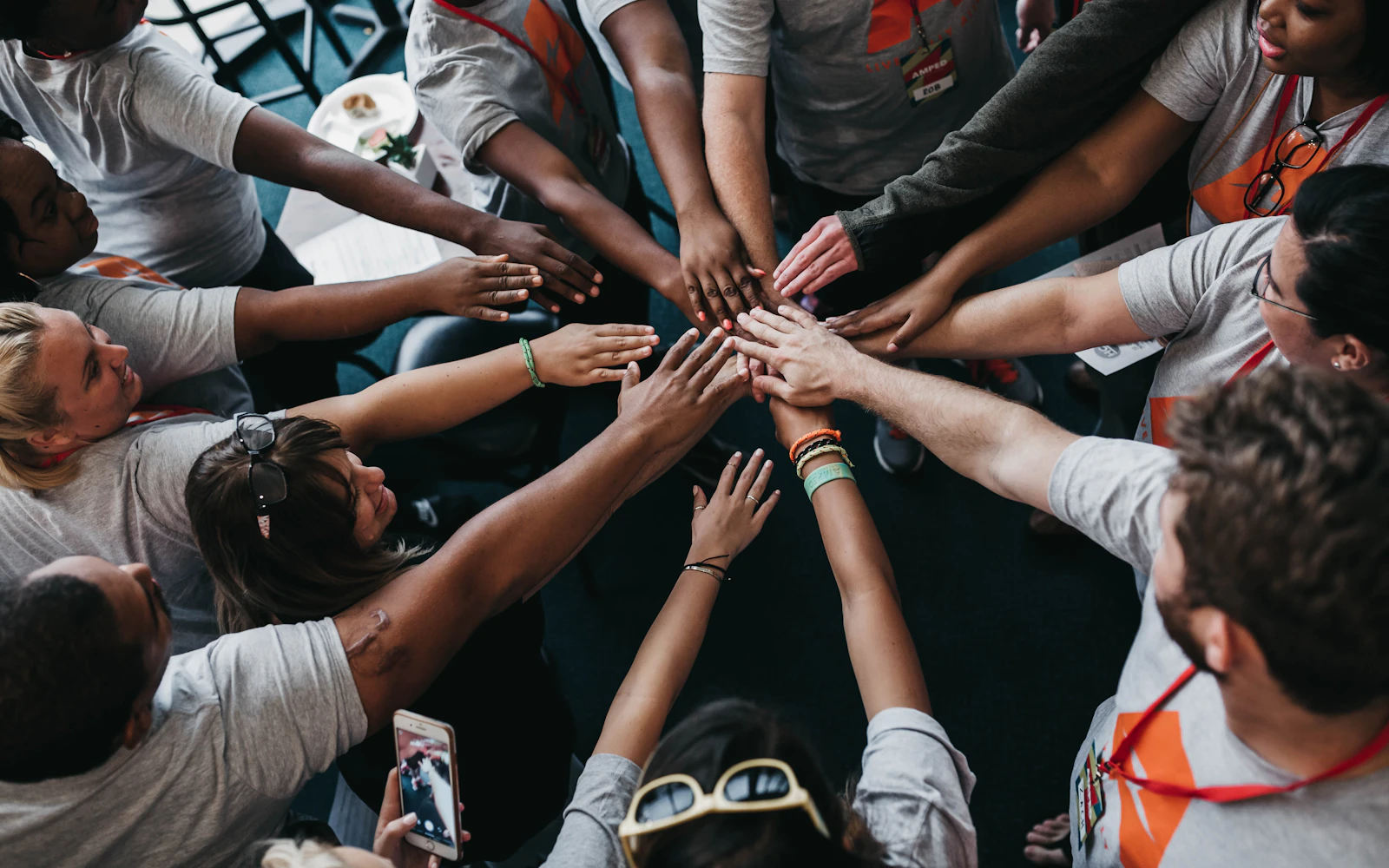 Community team joining hands together
