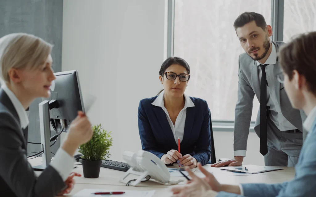 Security consultant website reviewed by a client in an office meeting