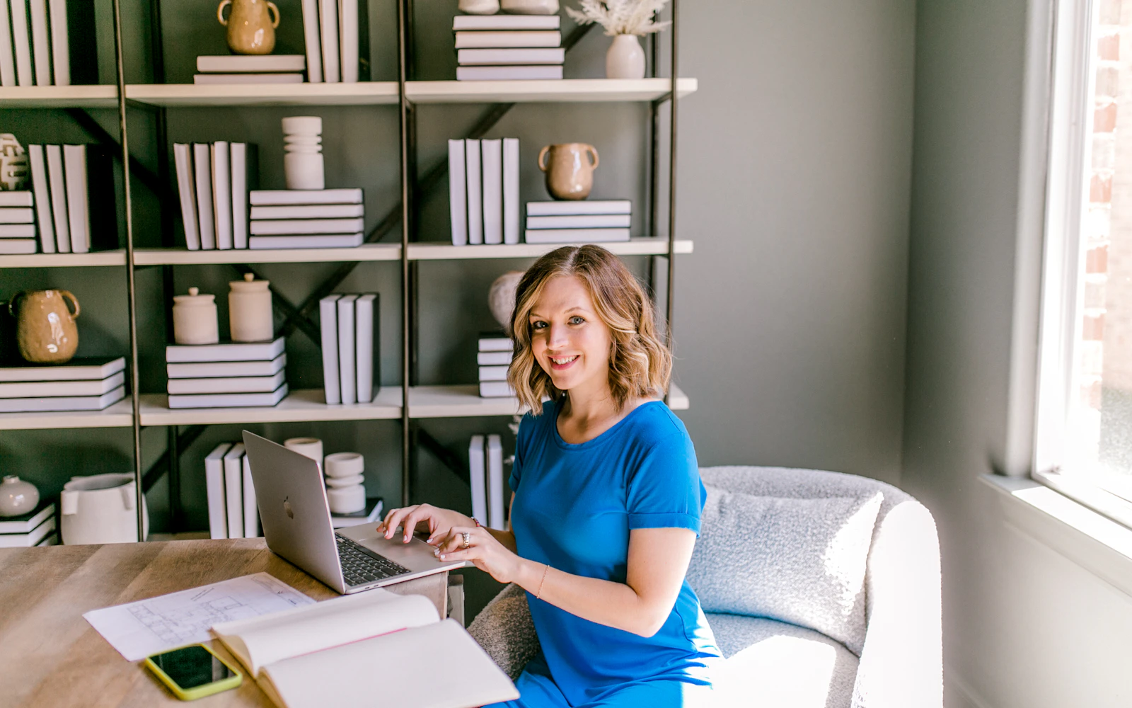 Consultant working on a content plan at her laptop