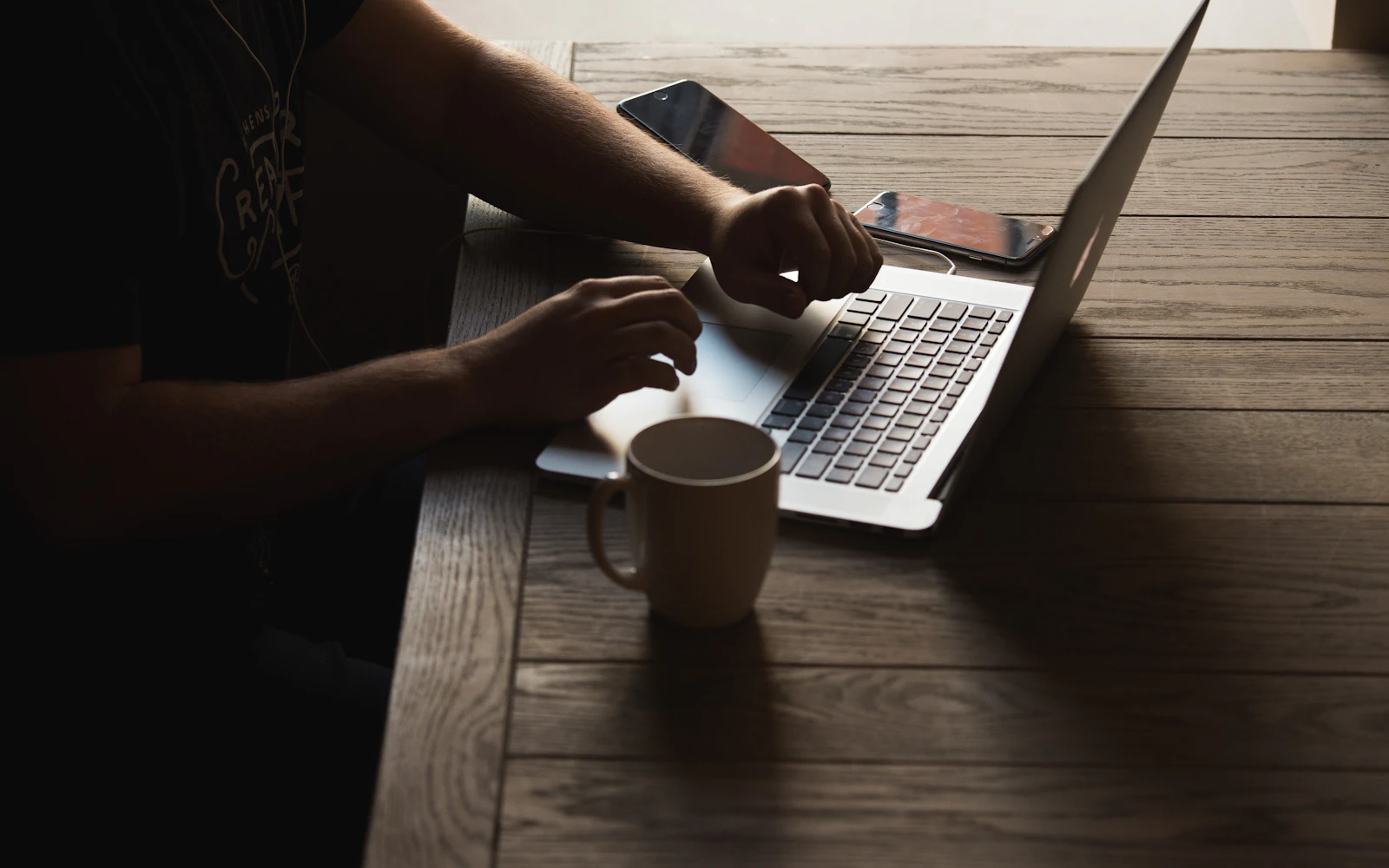Consultant reviewing website search performance over coffee