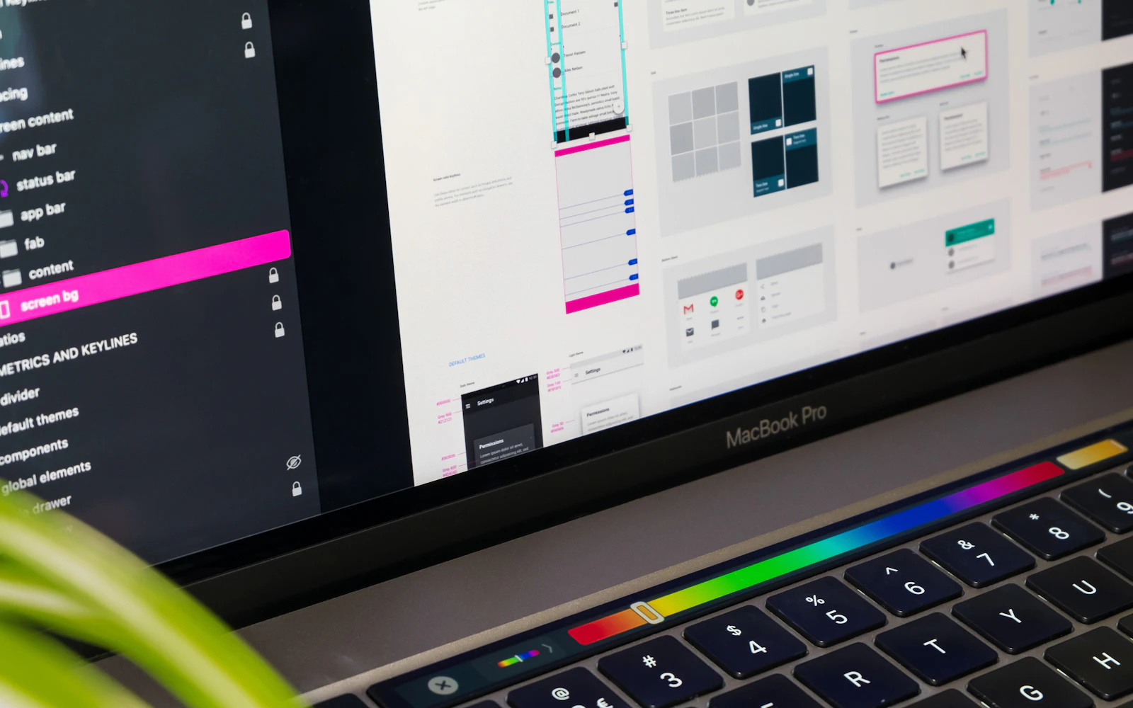 Designer working on a Squarespace website design on a laptop
