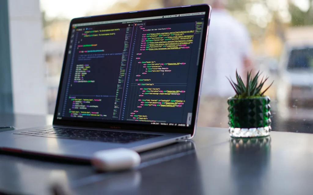 Web developer working through a technical SEO checklist on a laptop