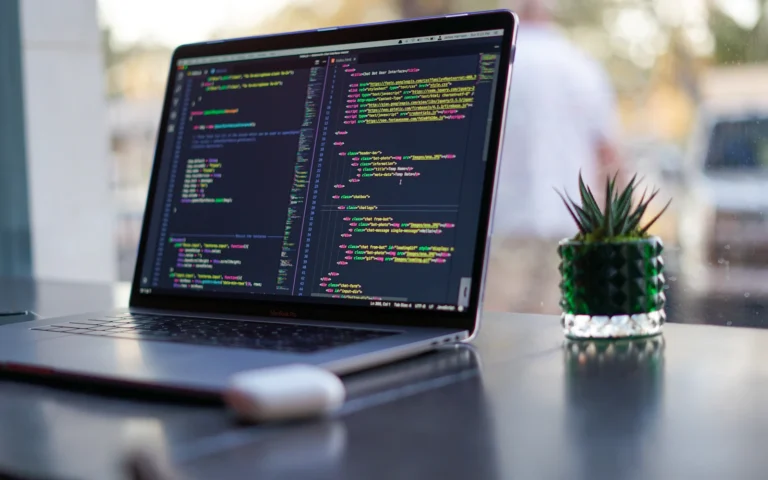 Web developer working through a technical SEO checklist on a laptop