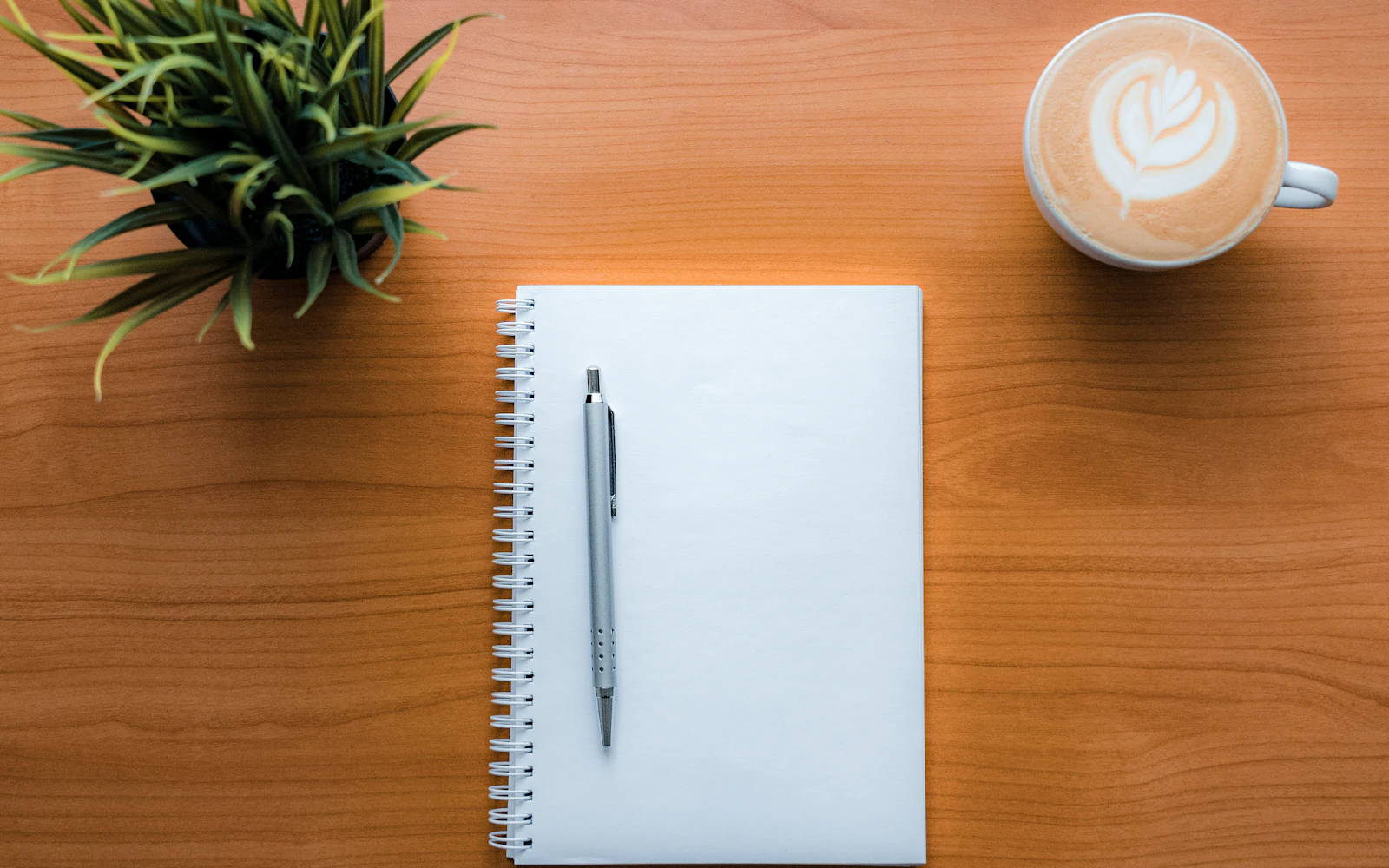 Notebook and coffee for drafting thought leadership content