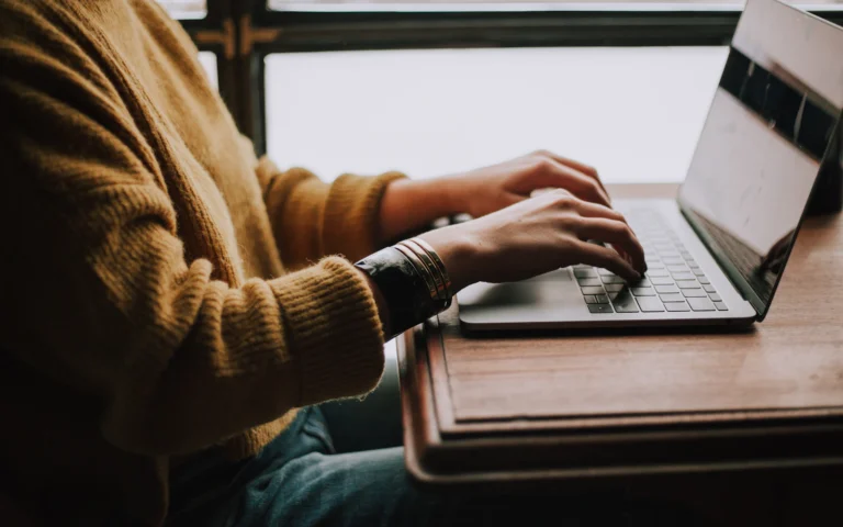 Person reviewing a website accessibility checklist on a laptop