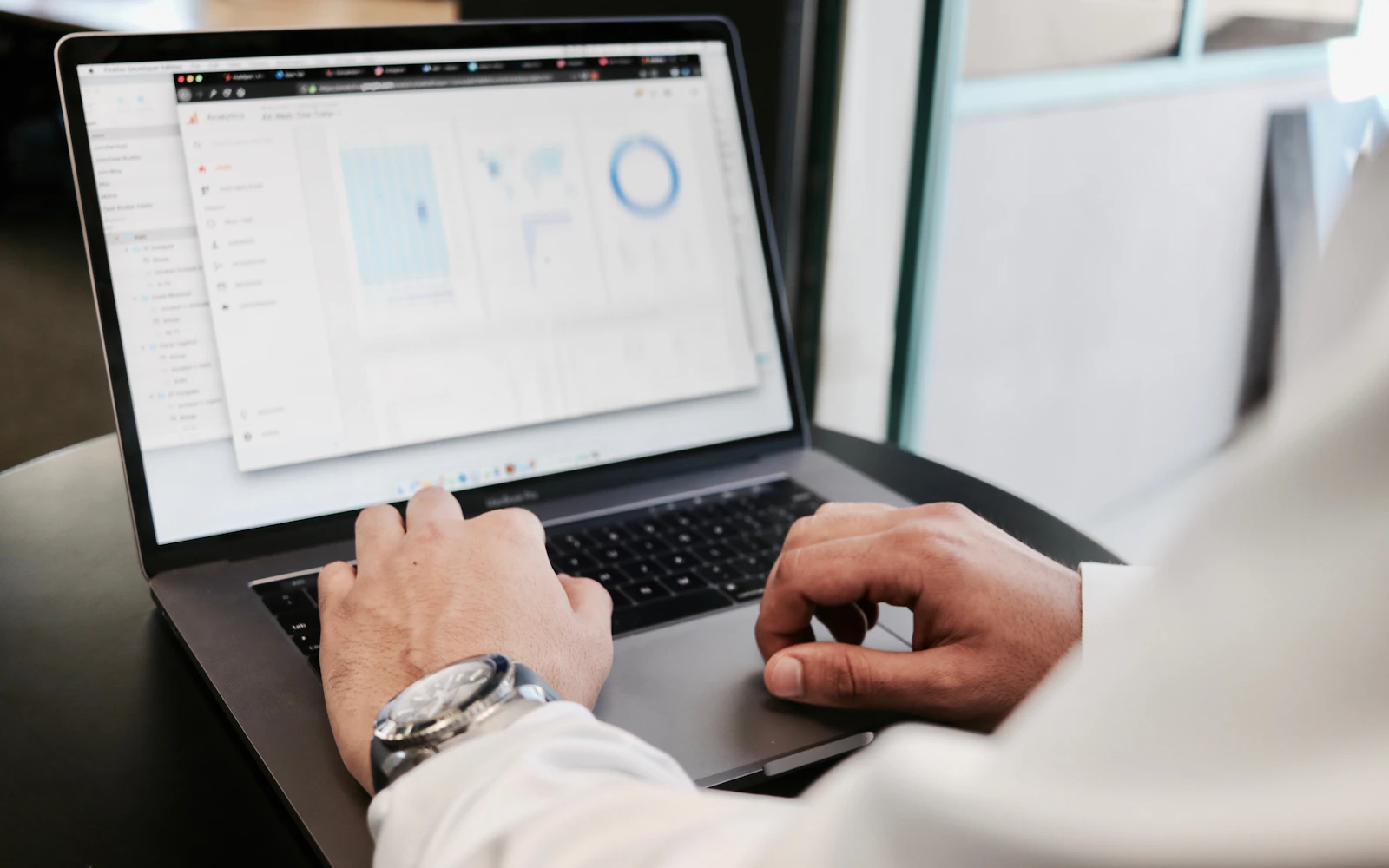 Consultant reviewing website conversion rate optimization results on a laptop