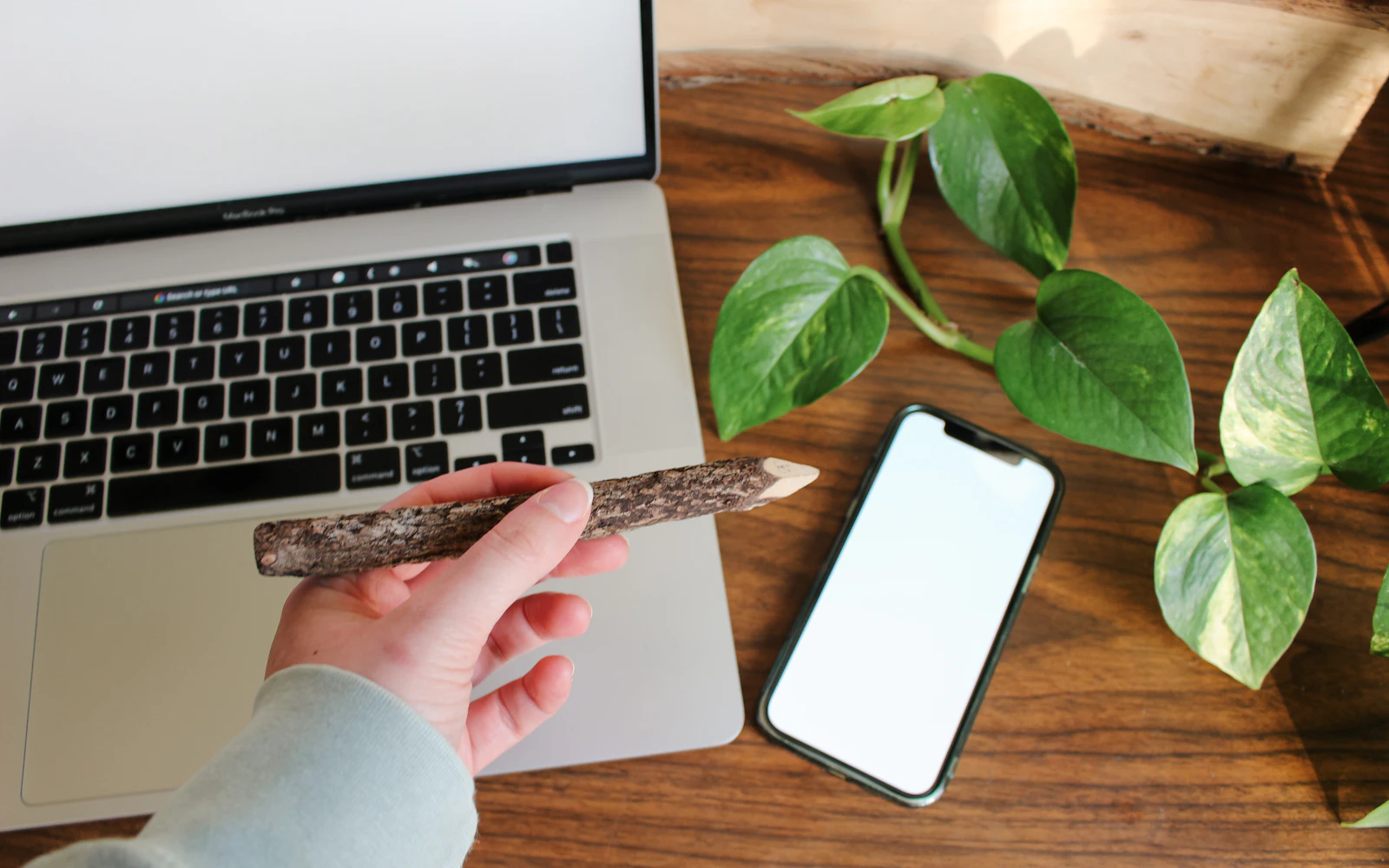 Consultant testing pages on a laptop and phone using a website launch checklist
