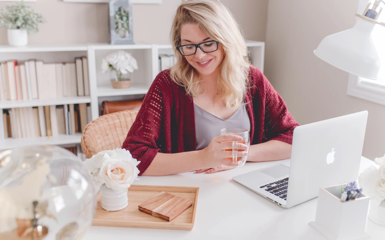 Consultant writing a welcome email sequence on a laptop at home