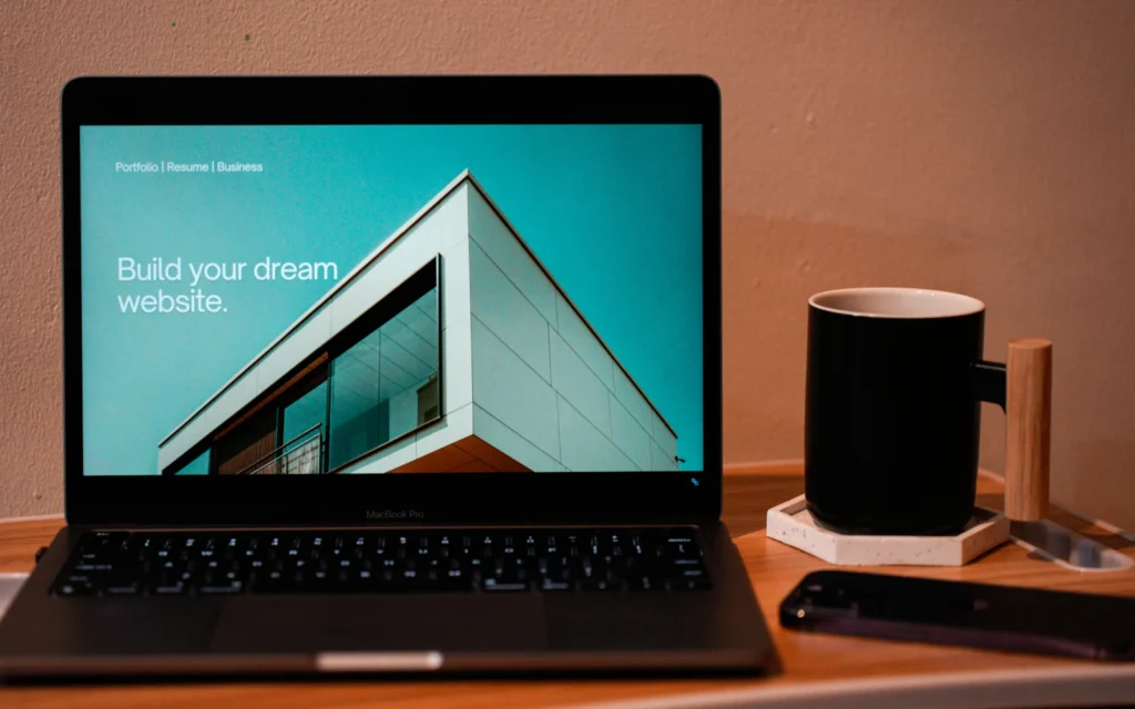 Consultant comparing Wix vs Squarespace on a laptop