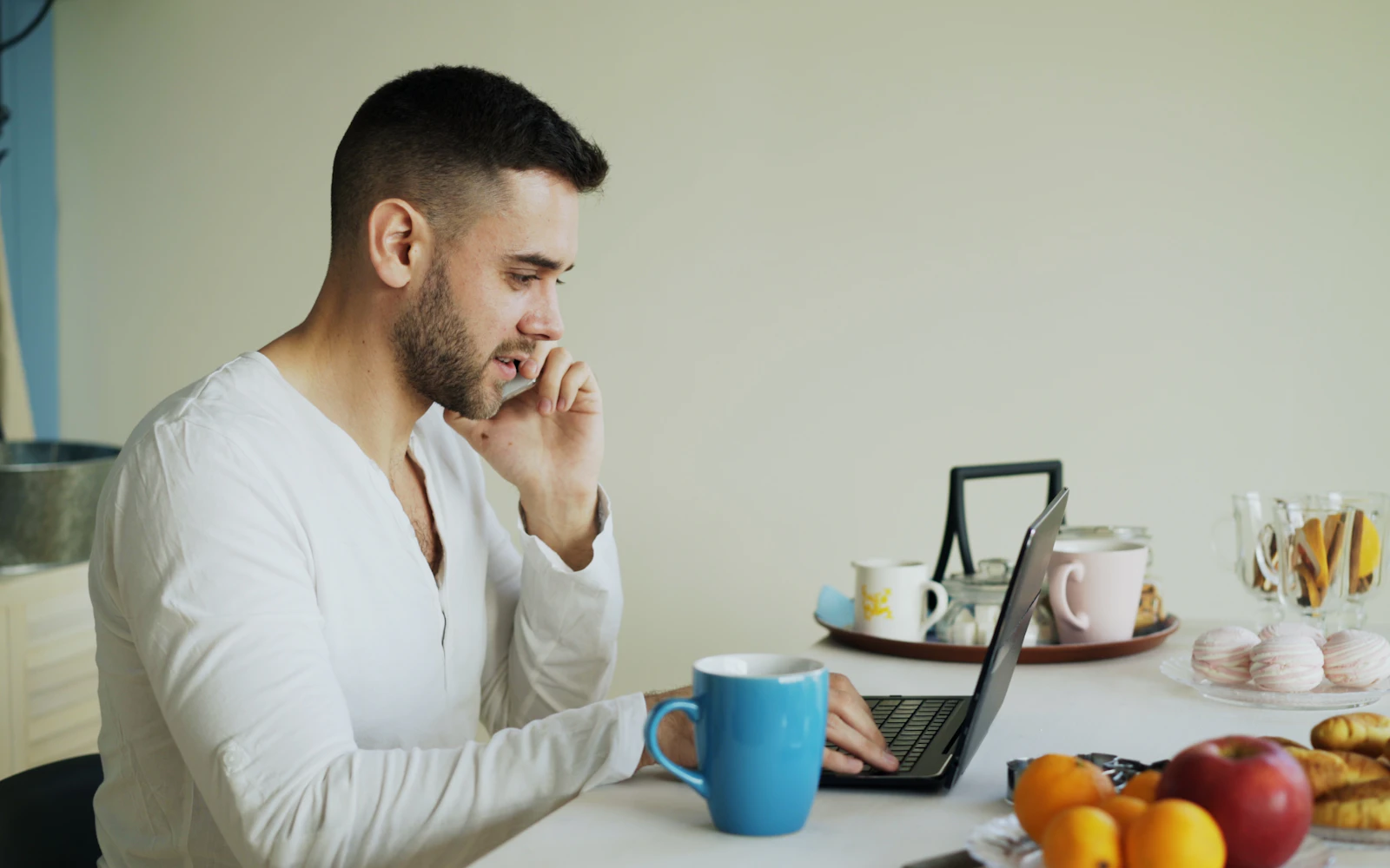 Business owner checking his website on a laptop