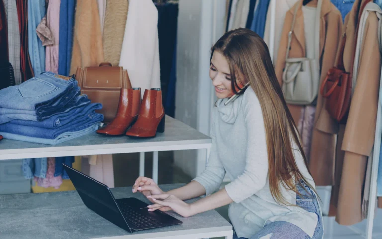 Small business owner choosing WordPress plugins for small business on a laptop