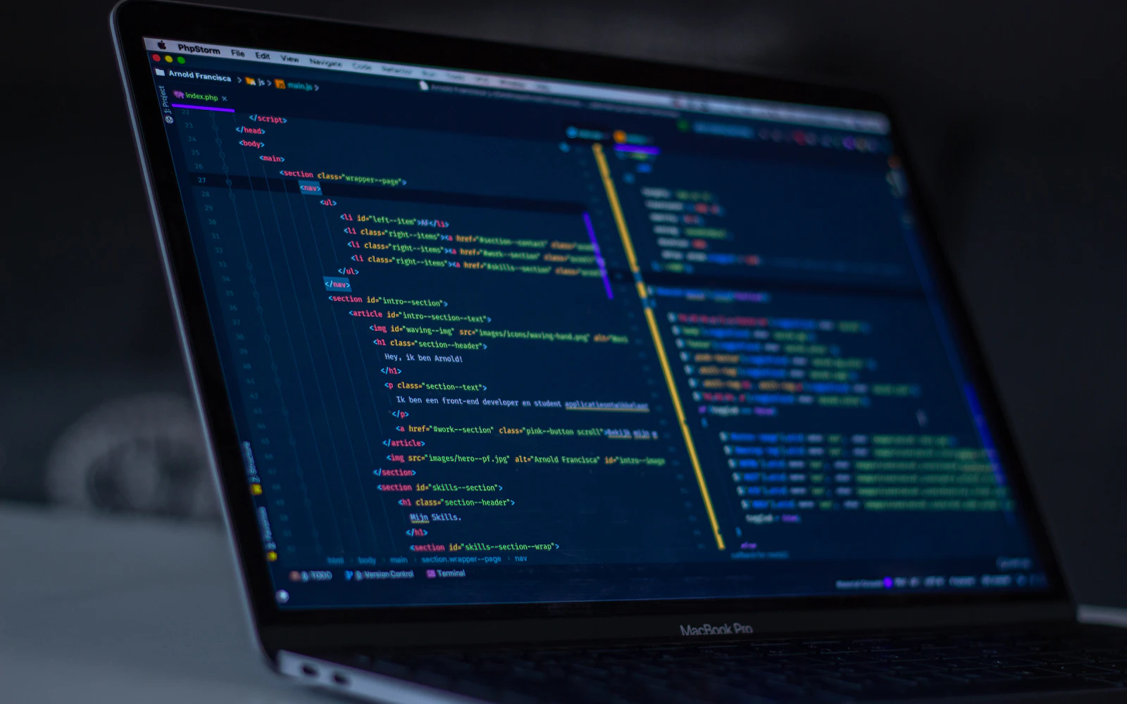 Developer reviewing WordPress security code on a laptop