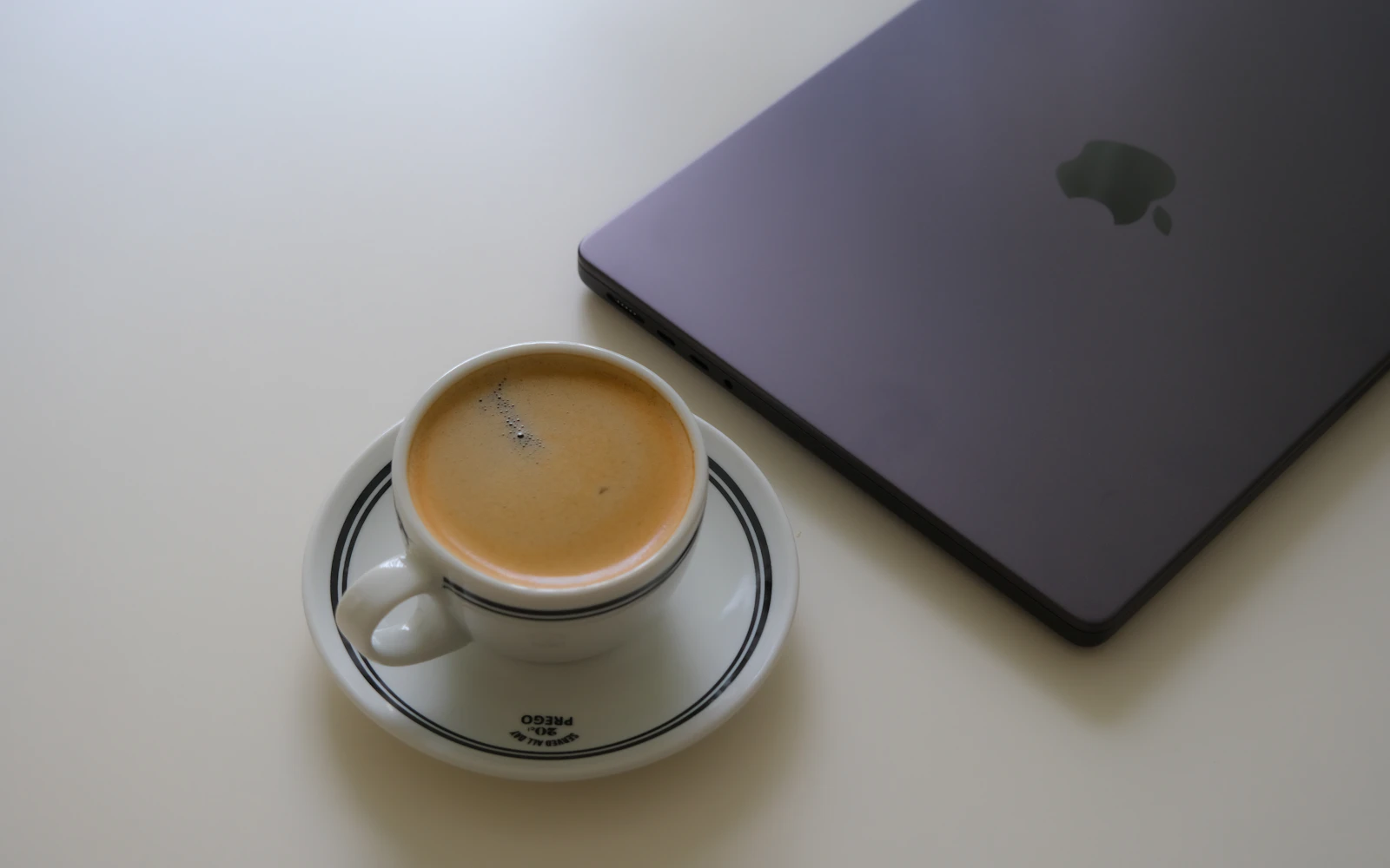 Laptop and coffee on a clean desk after a security review