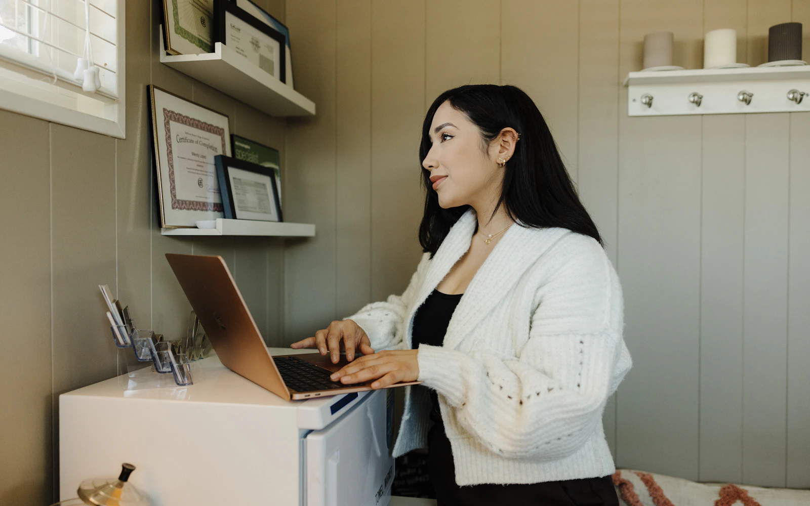 Small business owner editing a website on a laptop at a desk
